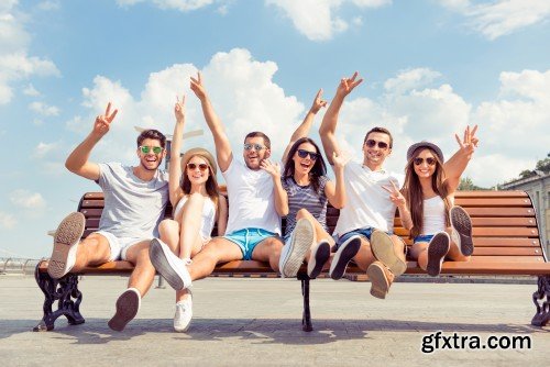 Group of diverse successful young  boyfriends and girlfriends having fun at summertime