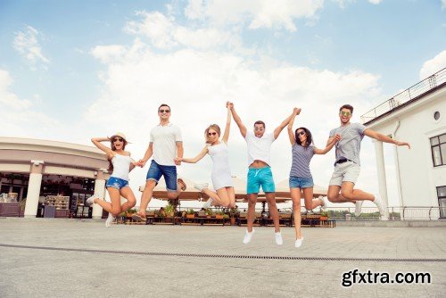 Group of diverse successful young  boyfriends and girlfriends having fun at summertime