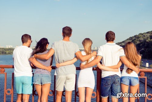 Group of diverse successful young  boyfriends and girlfriends having fun at summertime