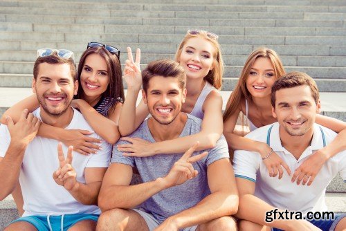 Group of diverse successful young  boyfriends and girlfriends having fun at summertime