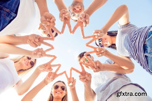 Group of diverse successful young  boyfriends and girlfriends having fun at summertime