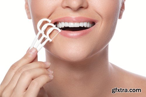 Happy smiling beautiful young woman cleaning skin by cotton pad, smiling woman and dental tools