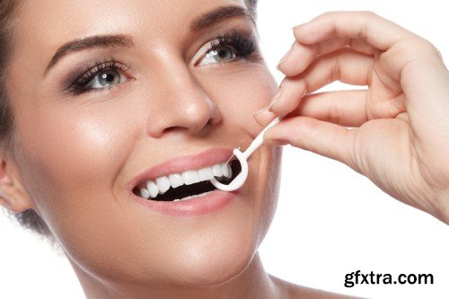 Happy smiling beautiful young woman cleaning skin by cotton pad, smiling woman and dental tools