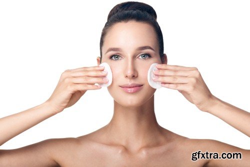 Happy smiling beautiful young woman cleaning skin by cotton pad, smiling woman and dental tools