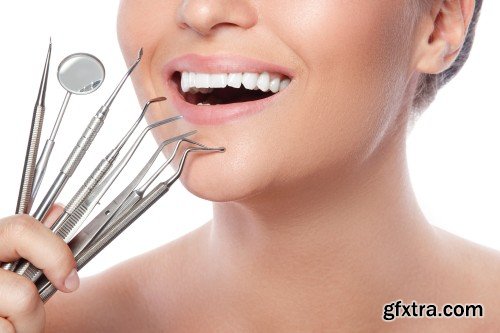 Happy smiling beautiful young woman cleaning skin by cotton pad, smiling woman and dental tools