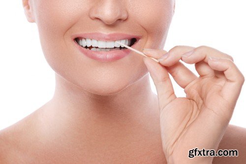 Happy smiling beautiful young woman cleaning skin by cotton pad, smiling woman and dental tools