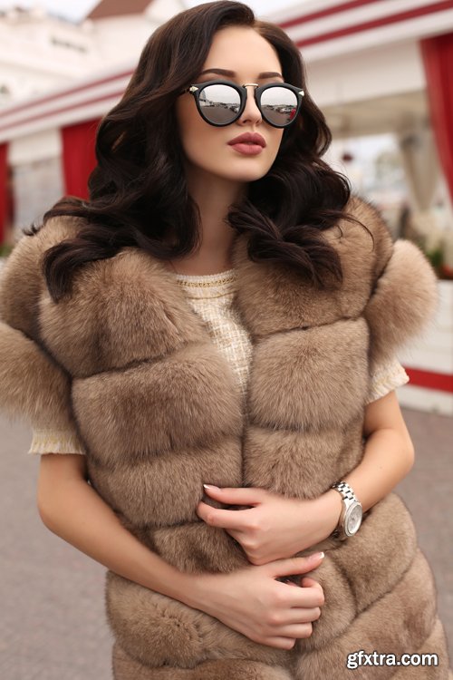 Fashion gorgeous sensual woman in elegant clothes and luxurious fur coat