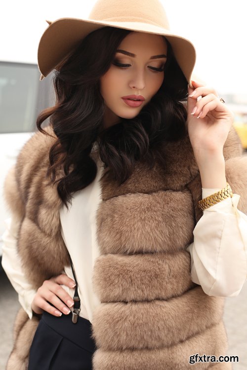 Fashion gorgeous sensual woman in elegant clothes and luxurious fur coat