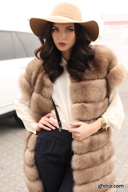 Fashion gorgeous sensual woman in elegant clothes and luxurious fur coat