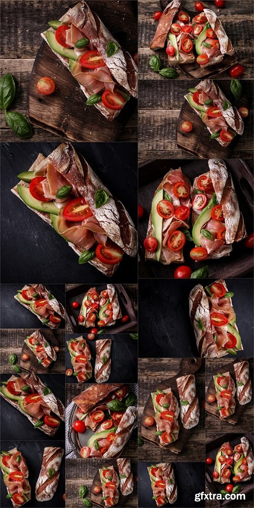 Ciabatta sandwich with prosciutto,avocado,cherry tomatoes and basil on dark background