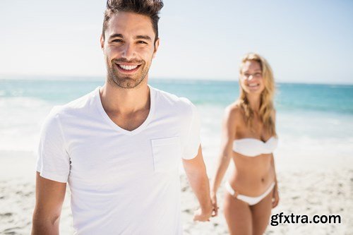 Young couple on the beach - 13xUHQ JPEG Photo Stock