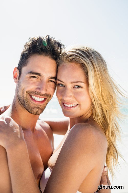 Young couple on the beach - 13xUHQ JPEG Photo Stock