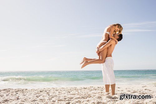 Young couple on the beach - 13xUHQ JPEG Photo Stock