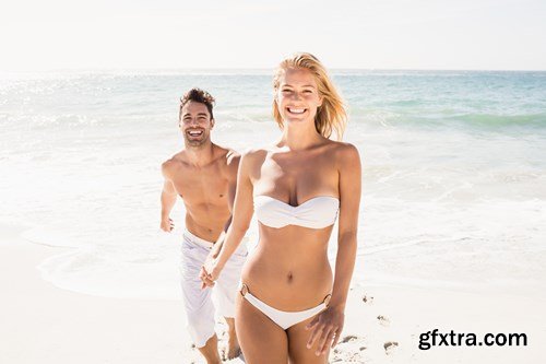 Young couple on the beach - 13xUHQ JPEG Photo Stock