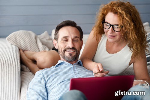 Woman and Man - Working with Laptop & Taking Notes 2 - 25xUHQ JPEG Photo Stock