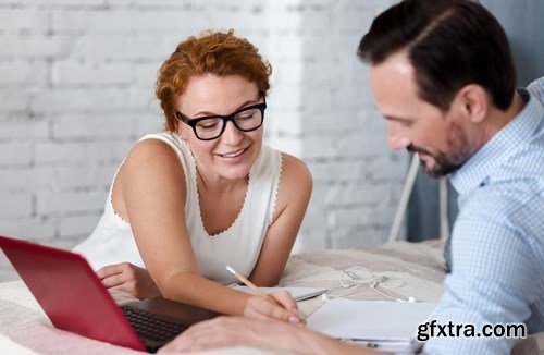 Woman and Man - Working with Laptop & Taking Notes 2 - 25xUHQ JPEG Photo Stock