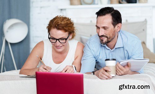 Woman and Man - Working with Laptop & Taking Notes 2 - 25xUHQ JPEG Photo Stock