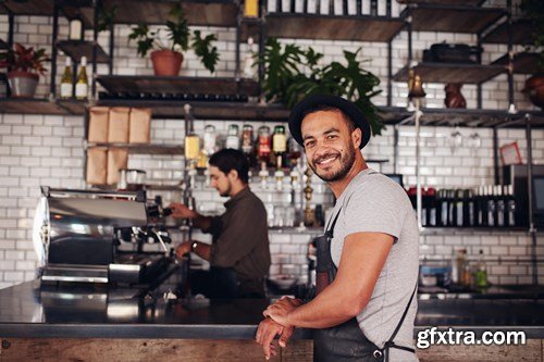 Cafe owner standing at the counter - 10xUHQ JPEG Photo Stock