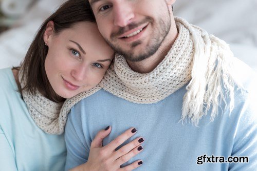 Happy young couple in a cozy bedroom - 20xUHQ JPEG Photo Stock