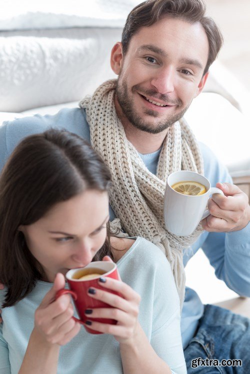 Happy young couple in a cozy bedroom - 20xUHQ JPEG Photo Stock