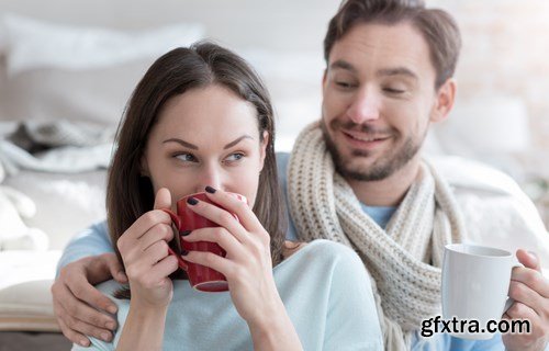 Happy young couple in a cozy bedroom - 20xUHQ JPEG Photo Stock