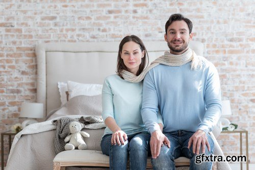 Happy young couple in a cozy bedroom - 20xUHQ JPEG Photo Stock