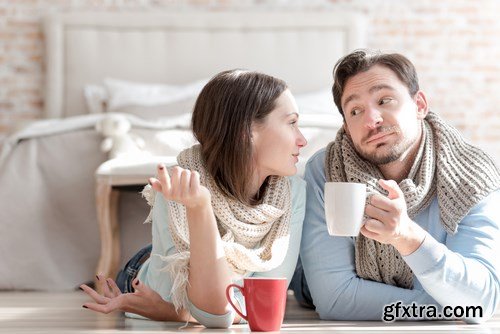 Happy young couple in a cozy bedroom - 20xUHQ JPEG Photo Stock