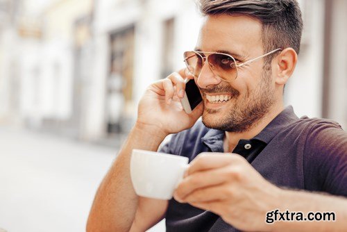 Smiling handsome guy listening to music - 24xUHQ JPEG Photo Stock