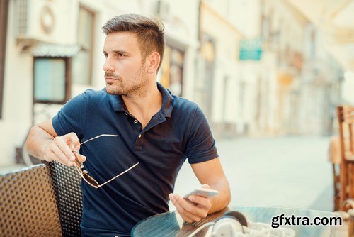 Smiling handsome guy listening to music - 24xUHQ JPEG Photo Stock