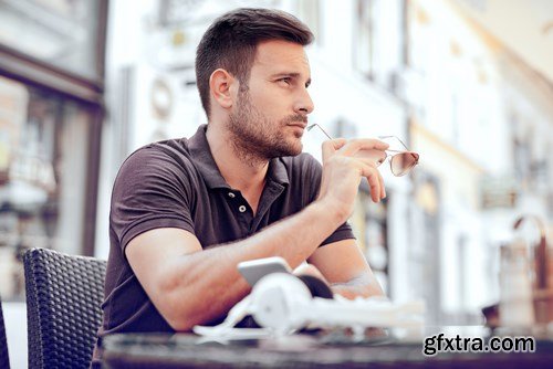 Smiling handsome guy listening to music - 24xUHQ JPEG Photo Stock