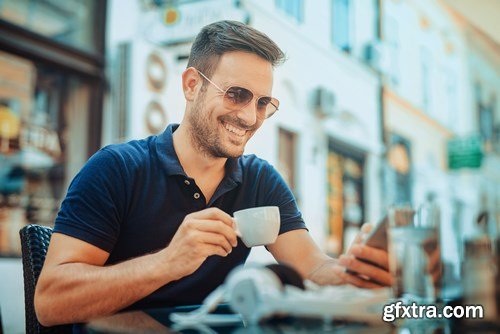 Smiling handsome guy listening to music - 24xUHQ JPEG Photo Stock