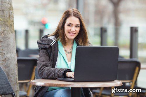 Group of students is sitting in an outdoor cafe and using laptop - 14xUHQ JPEG Photo Stock