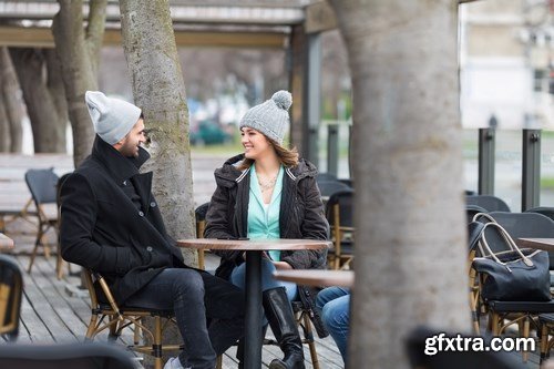 Group of students is sitting in an outdoor cafe and using laptop - 14xUHQ JPEG Photo Stock