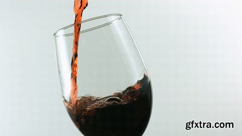 Slow motion pouring glass of red wine 3