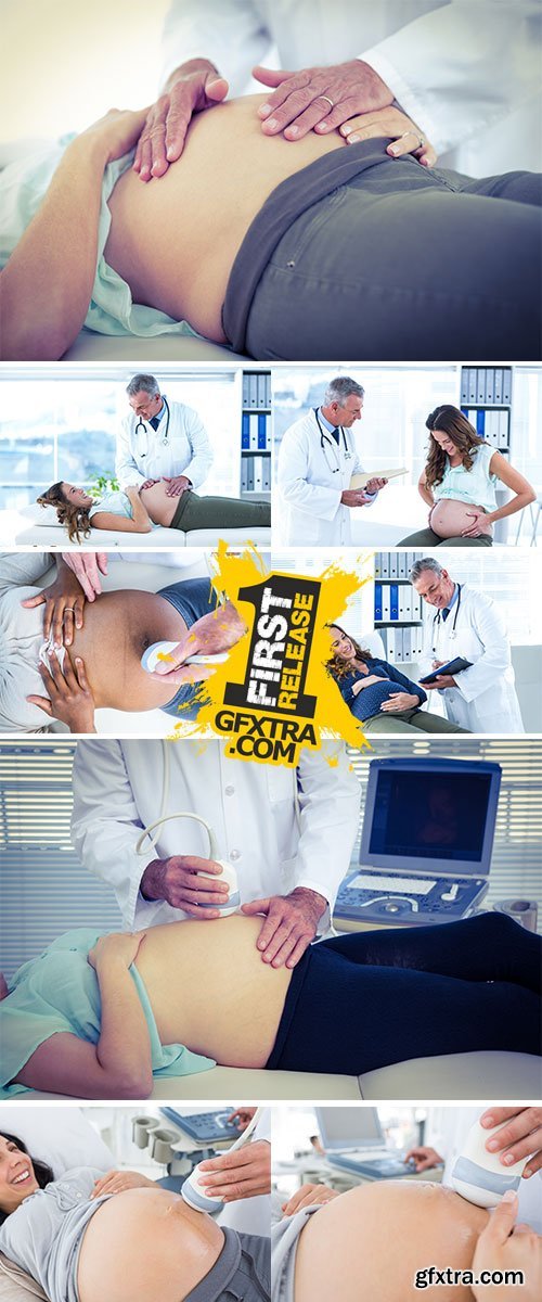 Doctor examining pregnant woman in clinic - Stock Image