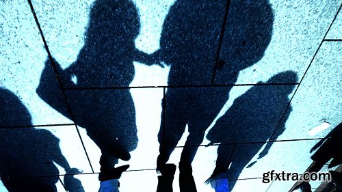 Group of people walking in slow motion silhouette city urban backgrounds