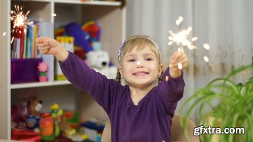 Child with sparklers at home