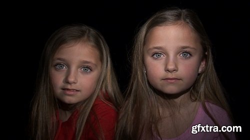 8 year old twins staring at camera