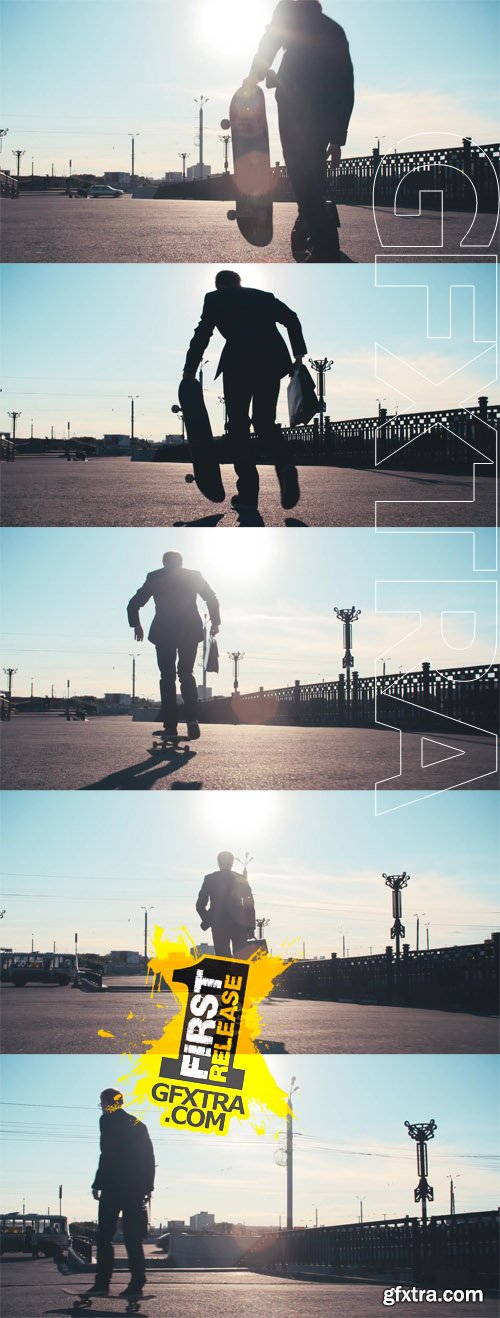 Ear view of businessman with briefcase skateboarding on the street at sunny summer day