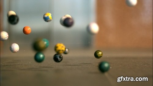 Slow motion bouncy balls across floor