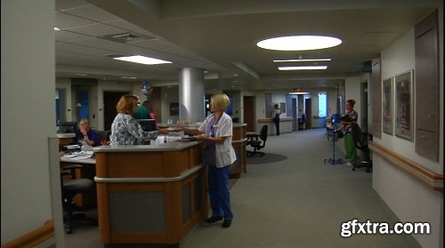 Gliding shot of busy nurses and staff in hospital