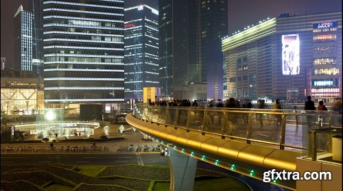 Circular pedestrian walkway above a traffic roundabout century avenue