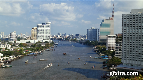 Time lapse nautical vessels along the chao phraya river passing bangkoks