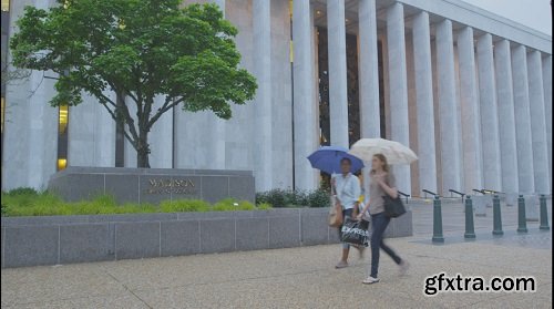 People walking by monument