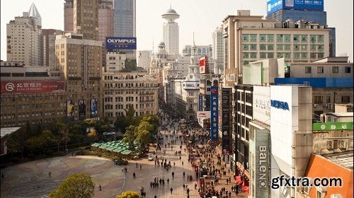 Tl pedestrians walking past stores on nanjing road shanghai china