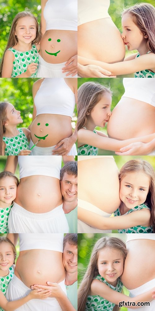 Happy family holding belly of pregnant woman