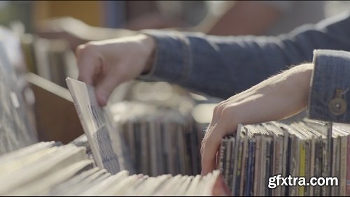 Couple At Record Store Sidewalk Sale, Young Woman Pulls Out A Few That She Likes 4k