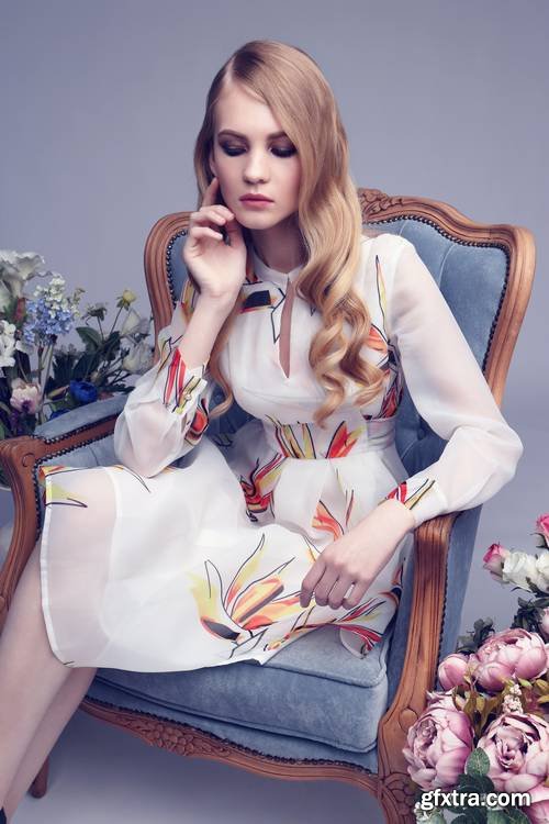 Fashion Portrait of Young Blond Woman with Flowers