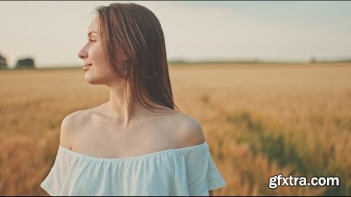 Beautiful girl running on sunlit wheat field slow motion 120 fps freedom concept happy woman having