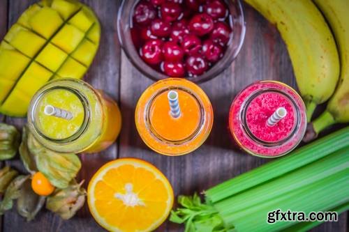 Multicolored Smoothies in Bottles of Mango, Orange, Banana, Celery, Berries